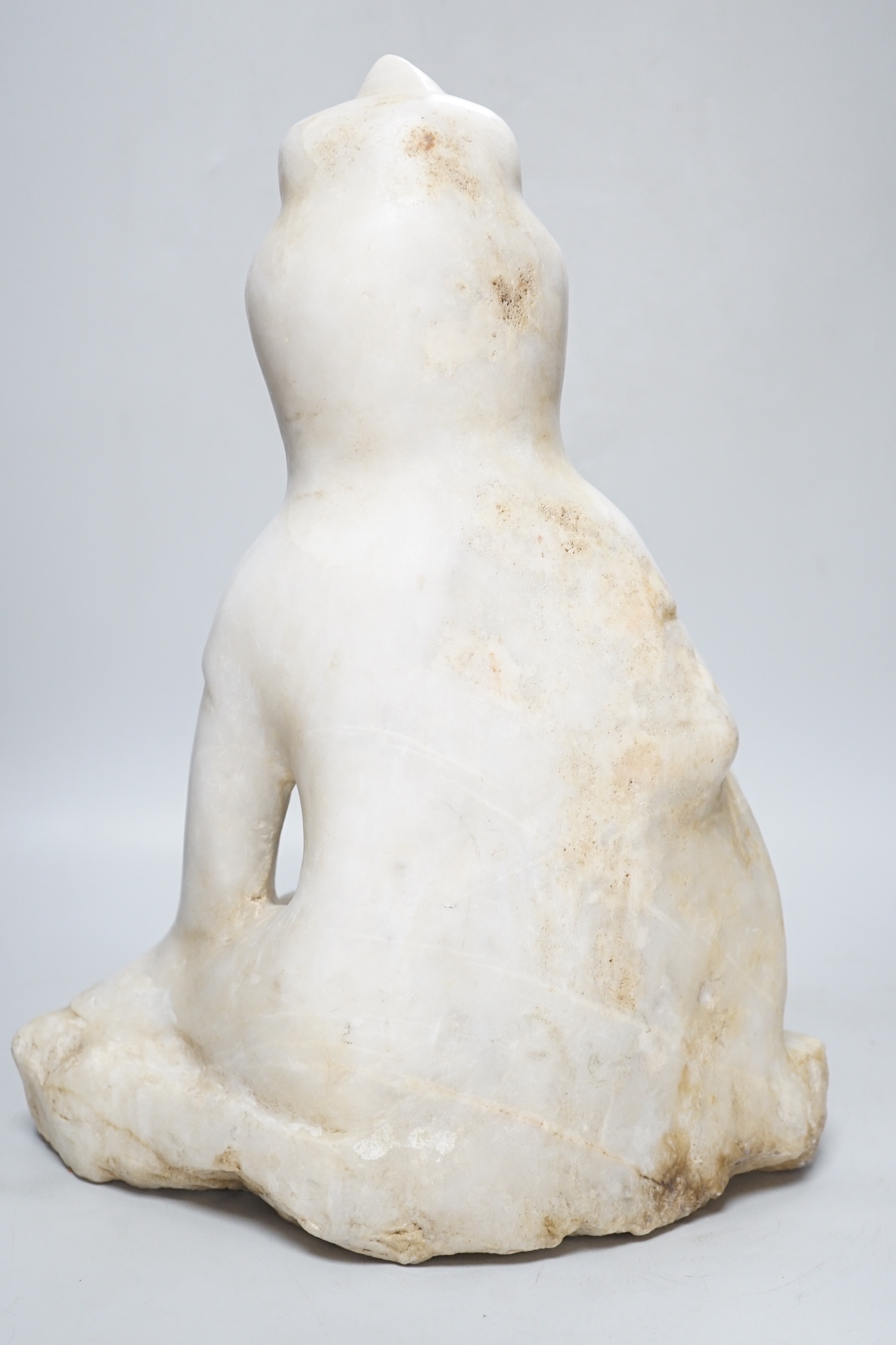 A Chinese carved marble figure of Guanyin, 42cm high